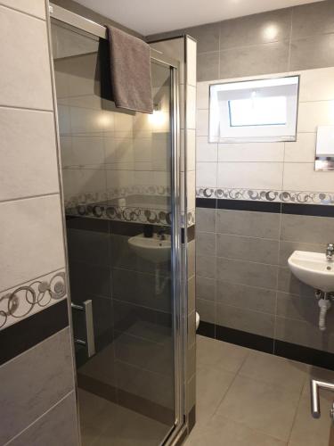 a bathroom with a shower and a sink at Apartments Horní Brána in Český Krumlov