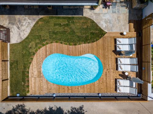 an overhead view of a swimming pool on a building at Diogenis Villa in Argostoli