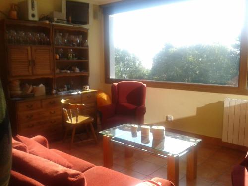 a living room with a couch and a table at Mendi Alai in Carranza