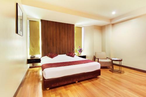 Ένα ή περισσότερα κρεβάτια σε δωμάτιο στο Bally Suite Silom