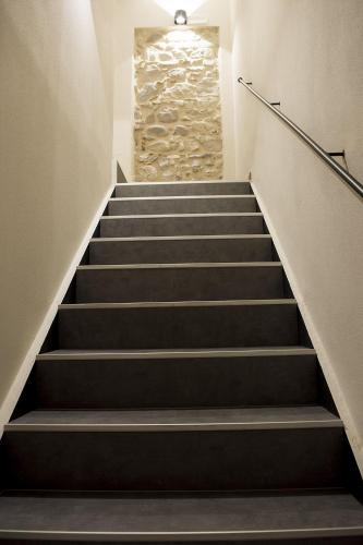 a set of stairs with a stone wall at Casa Beccherie in Lazise