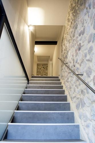 a set of stairs with a stone wall at Casa Beccherie in Lazise