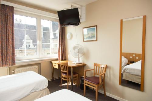 Katil atau katil-katil dalam bilik di Hotel Bristol Internationaal