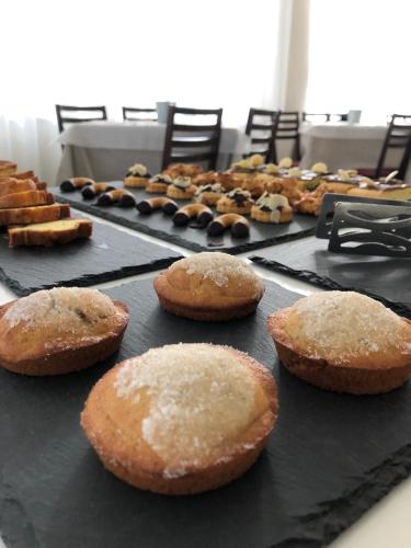 a bunch of muffins sitting on a table at Hotel Little in Rimini