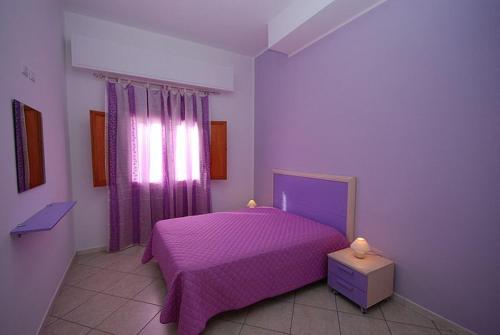 Appartamento Rosina tesisinde bir odada yatak veya yataklar