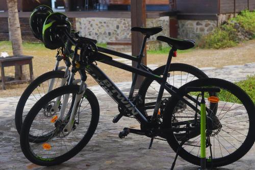 a bike parked on a sidewalk next to a bench at Tenuta Chatham Bay in Union Island