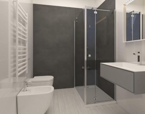 a bathroom with a shower and a toilet and a sink at N'Agorà B&B in Naples