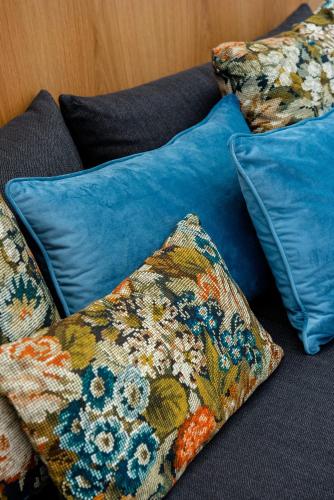 a group of pillows sitting on top of a couch at IN Lindos in Líndos