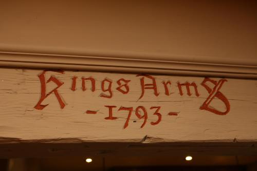 a sign that reads kings army on a wall at Kings Arms Hotel in Melrose