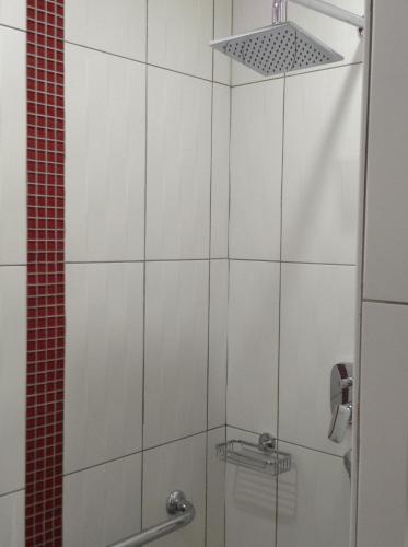 a bathroom with a shower with a glass door at Chambre d'hôte du HOUSSAY à VALENNES 72320 in Valennes