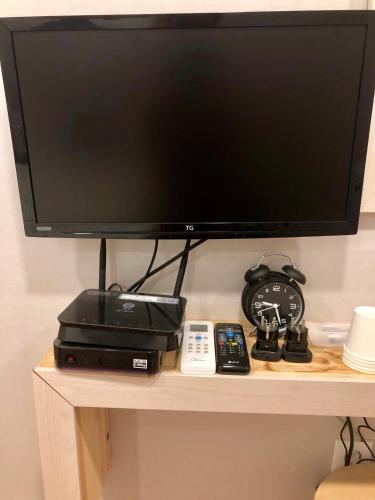 a flat screen tv sitting on top of a table at Dawoo House 1 in Hongdae in Seoul