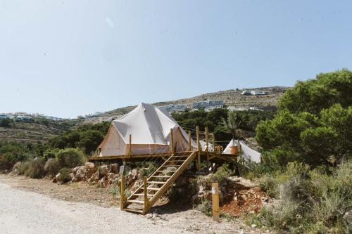 a yurt on the side of a dirt road at Dreamsea Mediterranean Camp in Benitachell