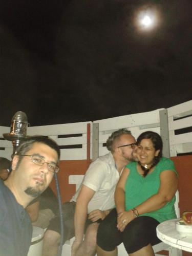 a group of people sitting on the back of a boat at Casa Grande Surf Hostel in El Médano