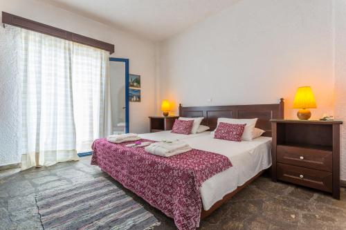 Кровать или кровати в номере Agionissi Resort