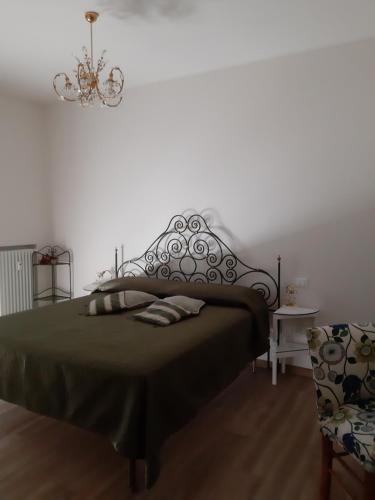Een bed of bedden in een kamer bij La Casa della Nonna