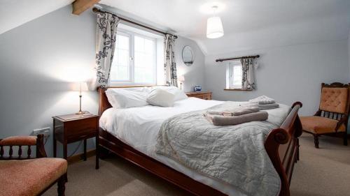 מיטה או מיטות בחדר ב-Bryn Llys Uchaf