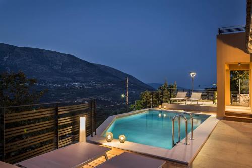 a swimming pool on top of a house at King Side Villa in Markáta