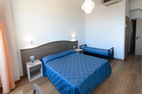 Postel nebo postele na pokoji v ubytování Hotel Turistica