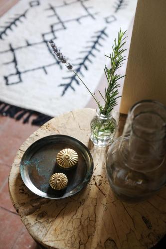 two cupcakes on a plate on a wooden table at Borgo Castello Panicaglia in Nocera Umbra