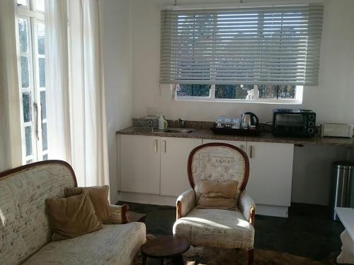 Η κουζίνα ή μικρή κουζίνα στο 4 On Braemar - Flat B