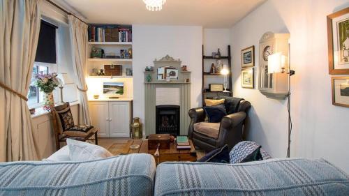 a living room with a couch and a fireplace at White O Morn in Conwy