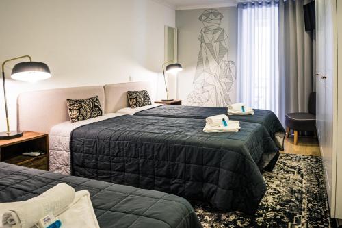 In Barcelos Hostel & Guest Houseにあるベッド