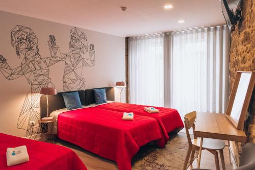 Cama ou camas em um quarto em In Barcelos Hostel & Guest House