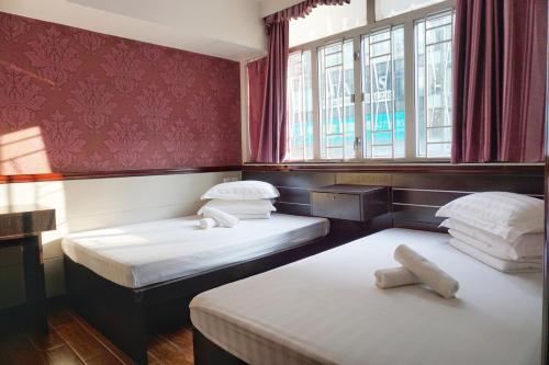 Un pat sau paturi într-o cameră la Hang Ho Hostel