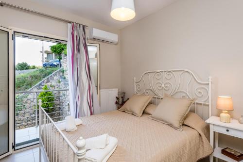 Ένα ή περισσότερα κρεβάτια σε δωμάτιο στο Adelinas' Apartment