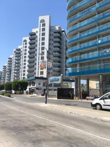 a city street with tall buildings and a street light at Admirals Suite, Gibraltar in Gibraltar