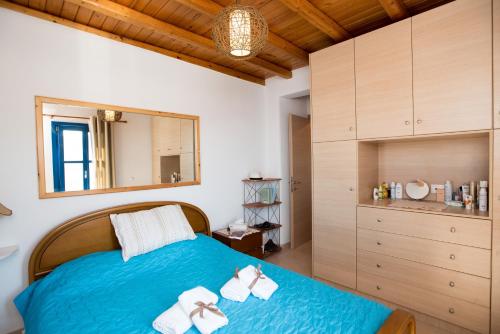 Ліжко або ліжка в номері Mykonos Pro-care Suites