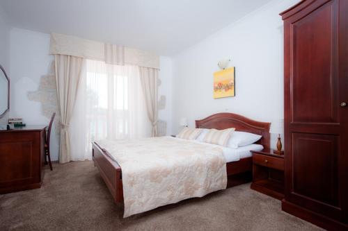 Posteľ alebo postele v izbe v ubytovaní Hotel Villa Barbat