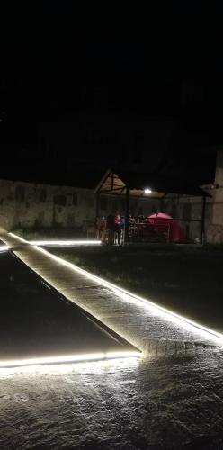 a long exposure photo of a street at night at Mziuri Guest House in Mestia