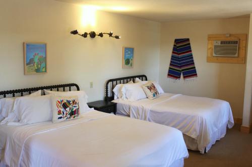Ένα ή περισσότερα κρεβάτια σε δωμάτιο στο The Hotel Limpia