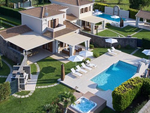 an aerial view of a villa with a swimming pool at S & O Villas Corfu in Dassia