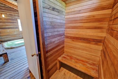 a sauna in a cabin with wood paneling at Idle A While Motel in Twisp