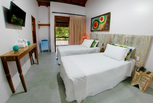 Cama ou camas em um quarto em Pousada Villa Maeva Itacare