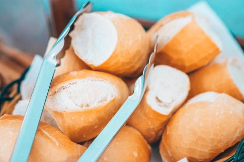 a basket of peeled oranges with tongs in them at Pousada Dona Emilia in Brotas