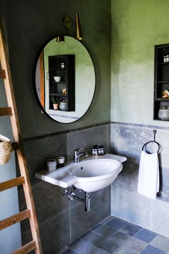 a bathroom with a sink and a mirror at Borgo Castello Panicaglia in Nocera Umbra