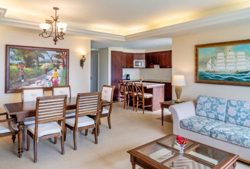 a living room filled with furniture and a tv at Jewel Grande Montego Bay Resort and Spa in Montego Bay