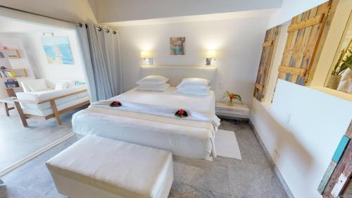 Letto o letti in una camera di Hotel Les Ondines Sur La Plage