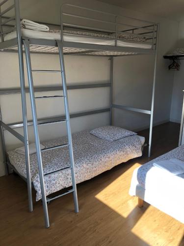 a bedroom with two bunk beds in a room at VILLA HOTEL in Malesherbes