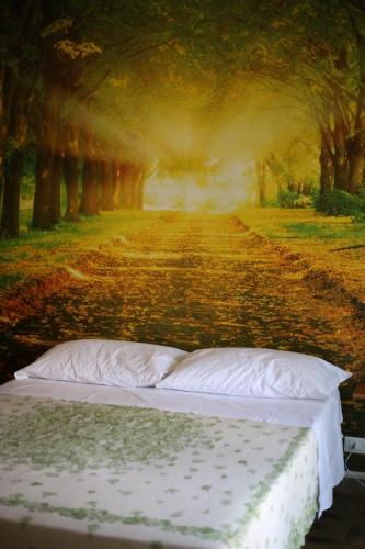 a bed sitting on the side of a dirt road at LA CASA DELL'ORSO in Ciampino