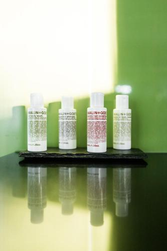 four bottles of moisturizers are sitting on a table at Mt Hay Retreat in Berry