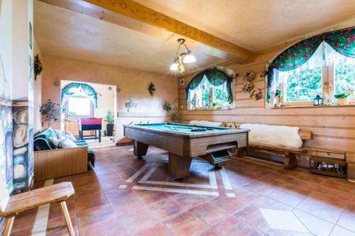 a room with a pool table in a house at Willa Cetynka in Zakopane