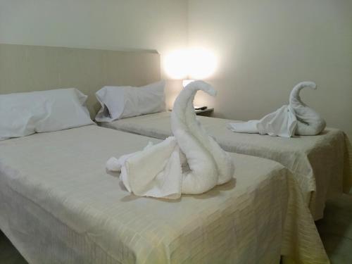 Una cama o camas en una habitación de SUEÑO URBANO