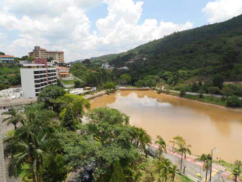 a view of a river in a city at Flat no Hotel Cavalinho Branco in Águas de Lindoia