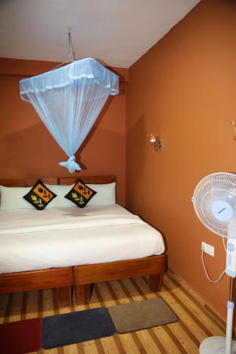 Postel nebo postele na pokoji v ubytování Secret Nest Homestay