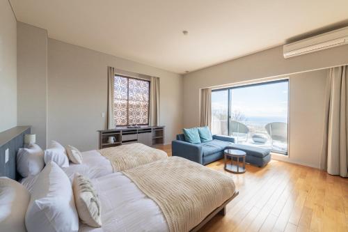 Postel nebo postele na pokoji v ubytování the salon 伊豆高原 Hotels & Resort