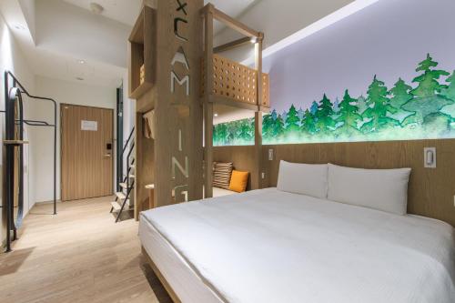 A bed or beds in a room at HOTEL PIN Jiaoxi